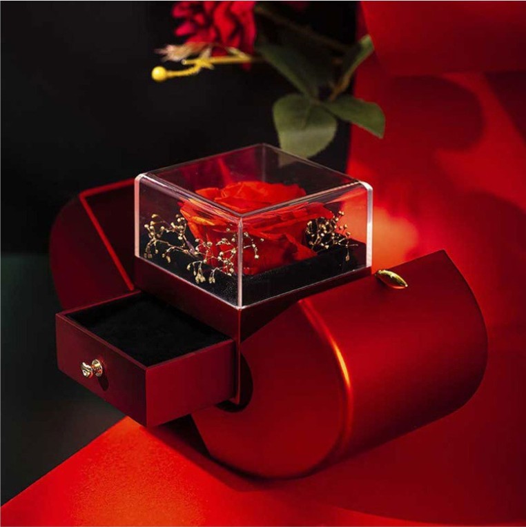 Apple-shaped keepsake box opened to show the rose inside
