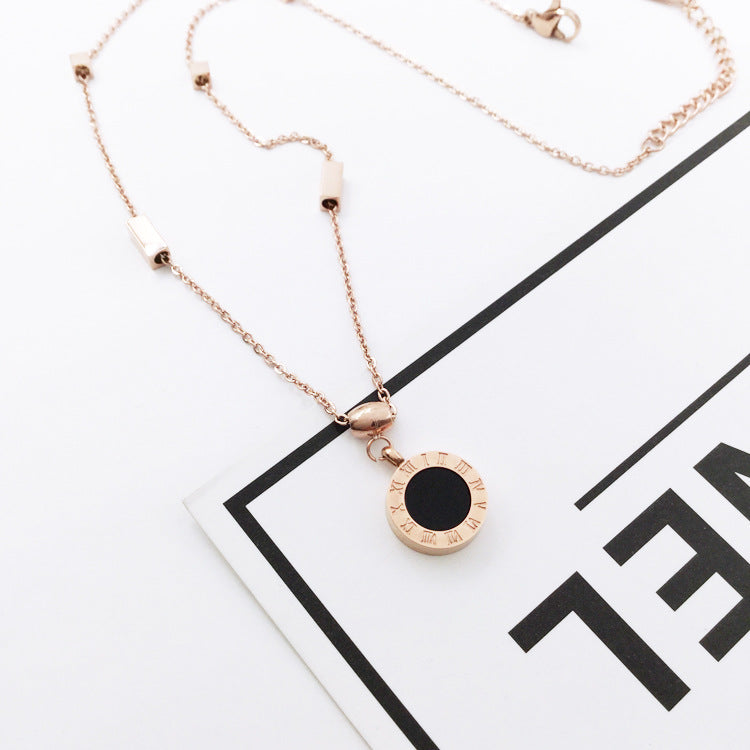 Roman numeral necklace pendant reversed to the white face on gold-plated chain