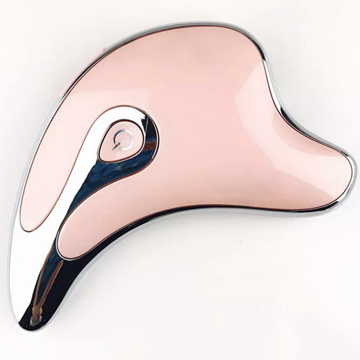 Gua sha facial massager used along the jawline