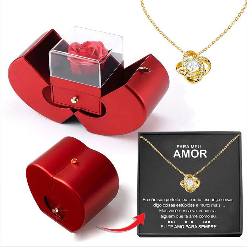 Apple gift box with four-leaf clover necklace, styled shot