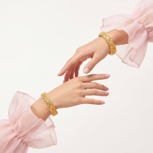 Women wearing the 18K gold-plated four-leaf clover bracelet