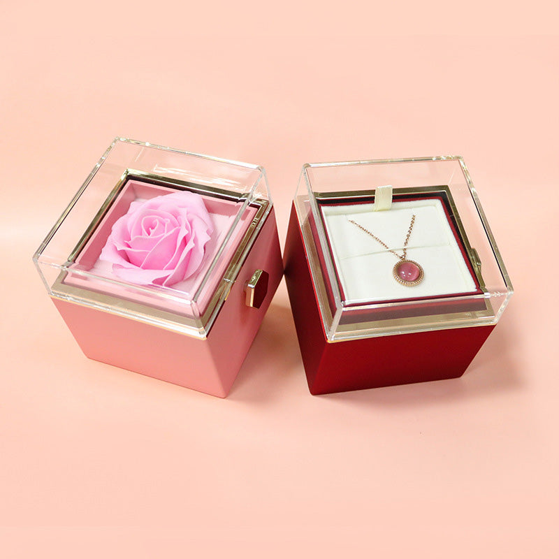 Rotating rose gift box shown held in hand
