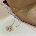 Four-leaf clover folding heart necklace worn at clavicle length