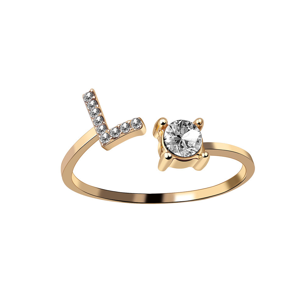 Initial letter ring in gold, styled shot